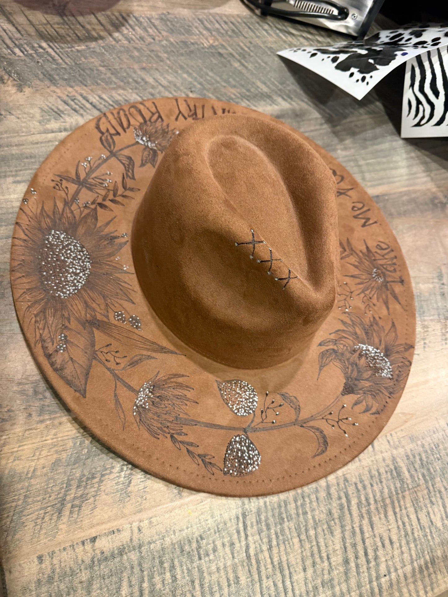 "Oakley" - a gorgeous brown, hand burned hat with flowers.