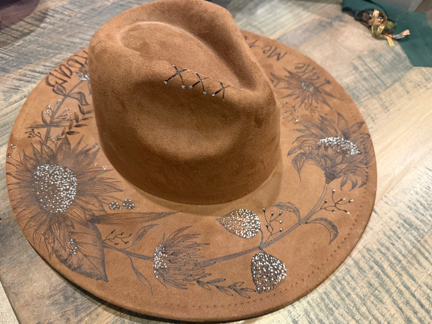 "Oakley" - a gorgeous brown, hand burned hat with flowers.