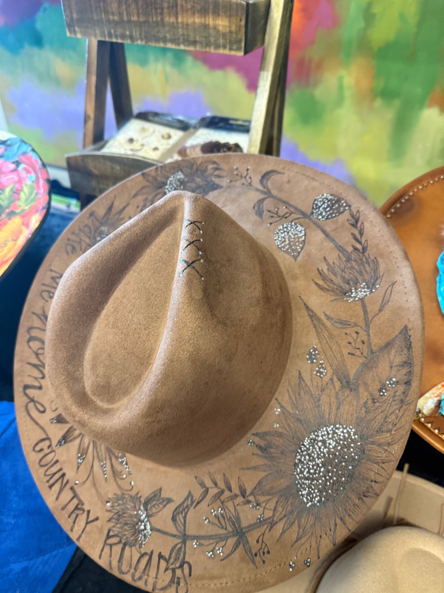 "Oakley" - a gorgeous brown, hand burned hat with flowers.
