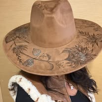 "Oakley" - a gorgeous brown, hand burned hat with flowers.