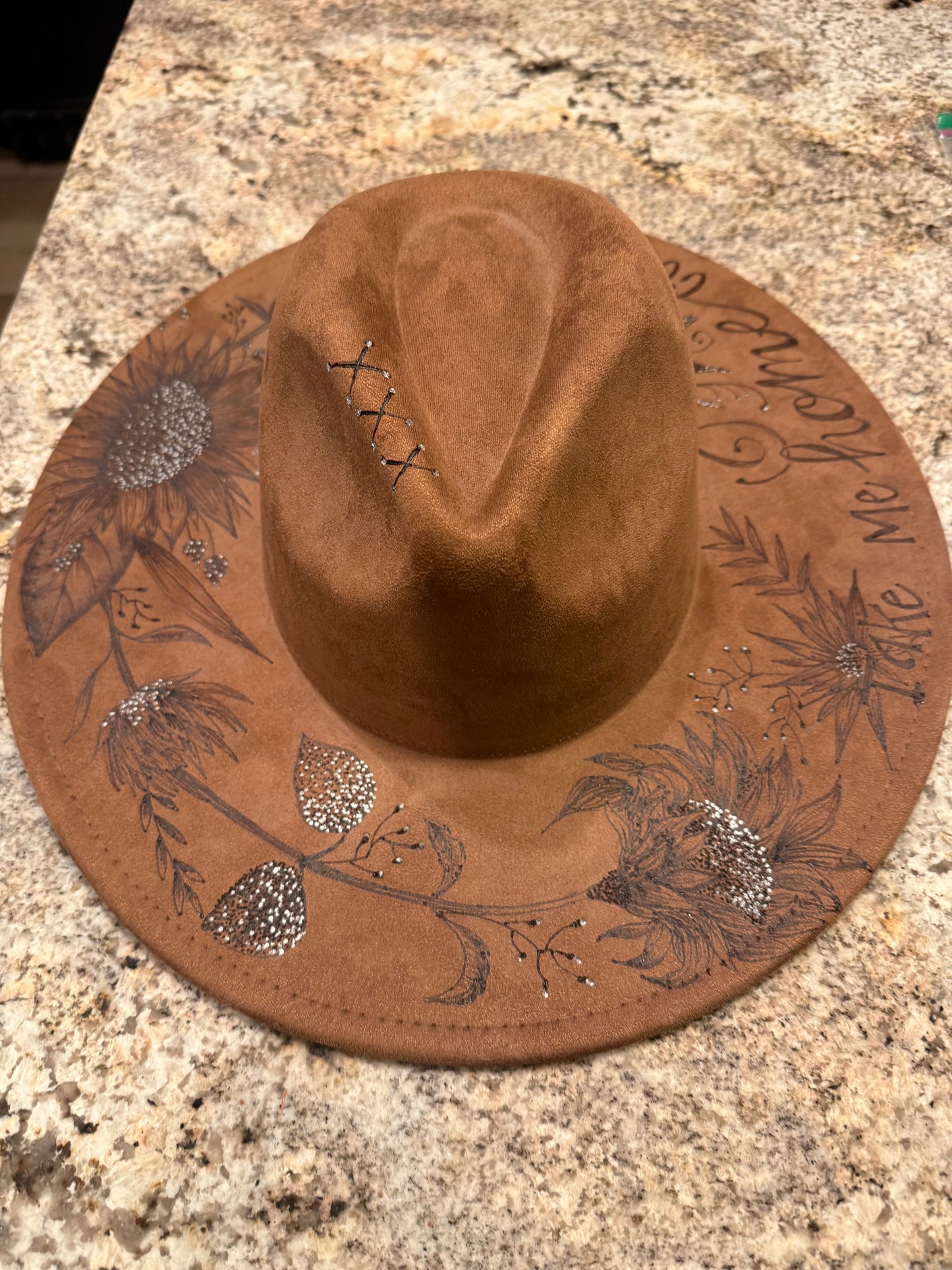 "Oakley" - a gorgeous brown, hand burned hat with flowers.