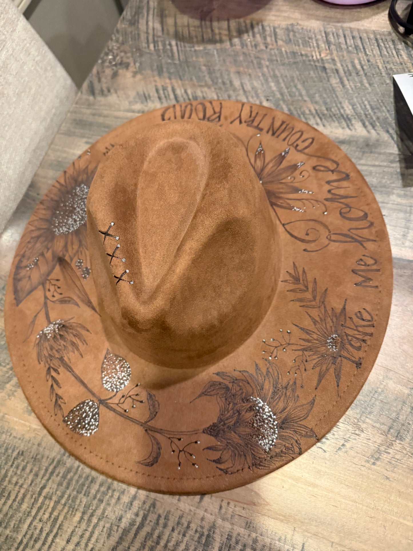 "Oakley" - a gorgeous brown, hand burned hat with flowers.