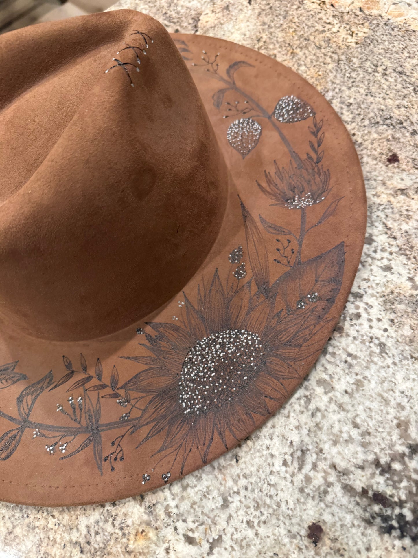"Oakley" - a gorgeous brown, hand burned hat with flowers.